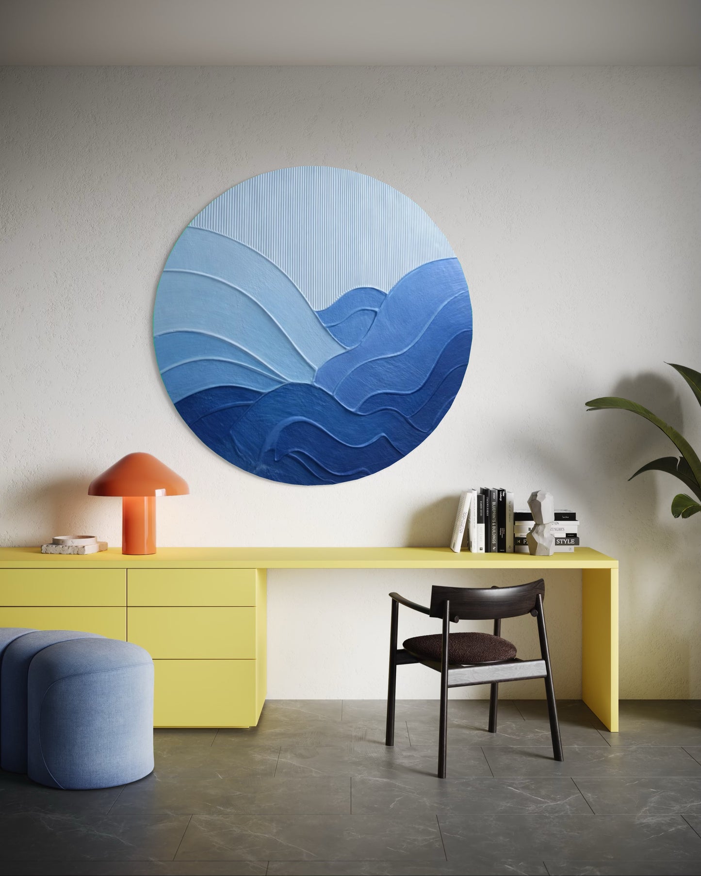 Modern interior with a yellow desk, blue chair, and abstract blue wall art.