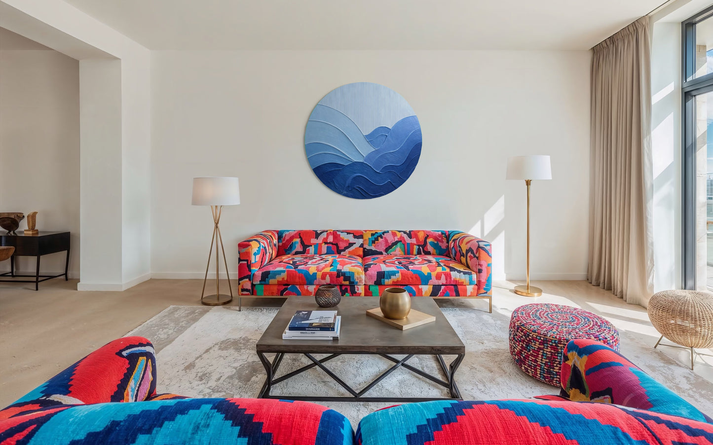 Modern living room with colorful sofa, abstract wall art, and coffee table.
