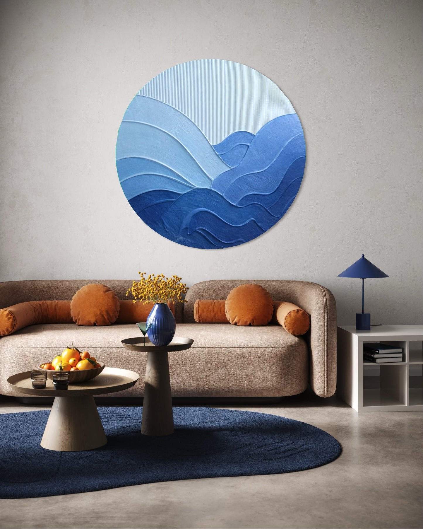 Living room with a blue abstract wall art piece above a beige sofa.