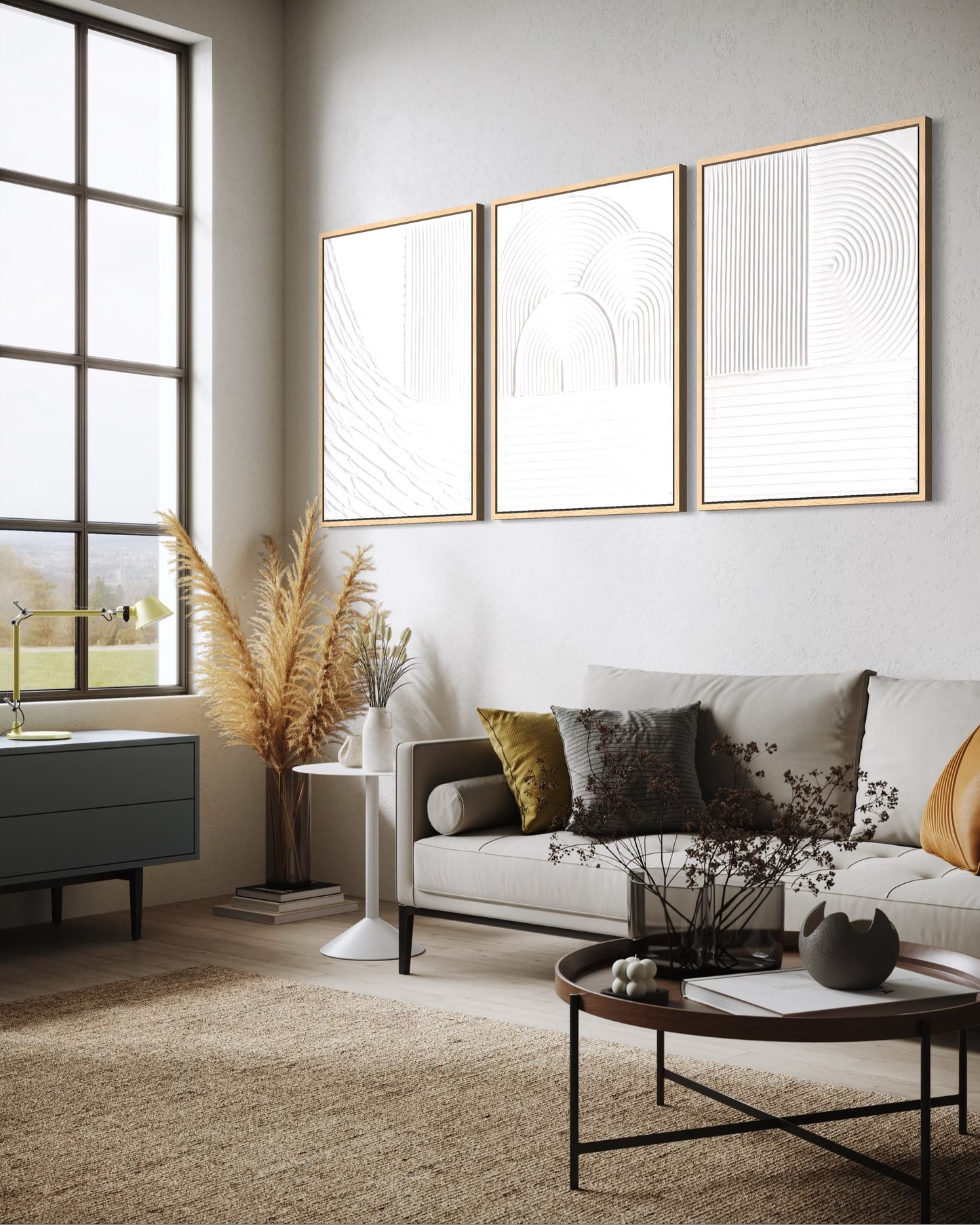 Modern living room with a white sofa, decorative pillows, and abstract wall art.