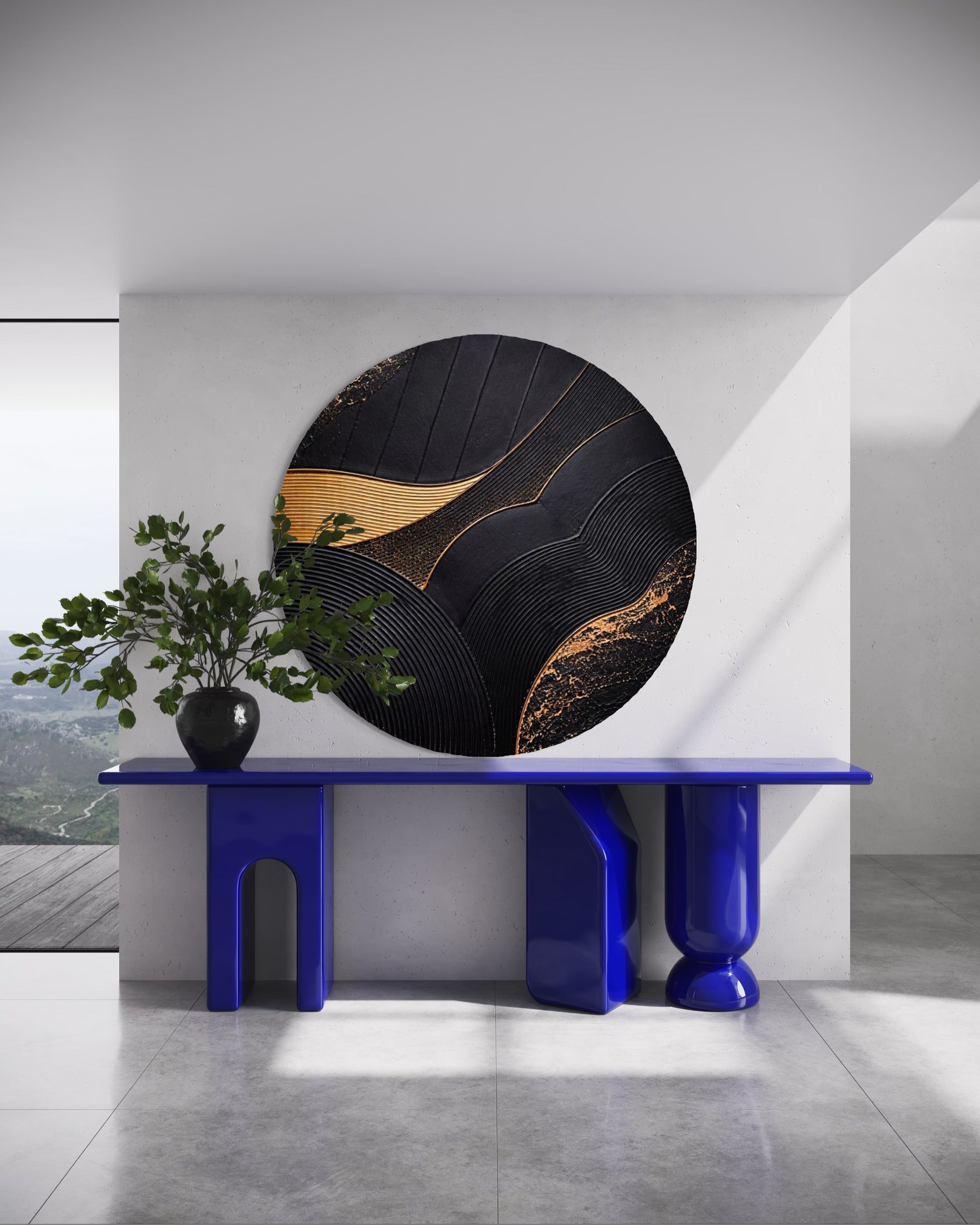 Modern interior with a round black and gold wall art piece on a white wall.