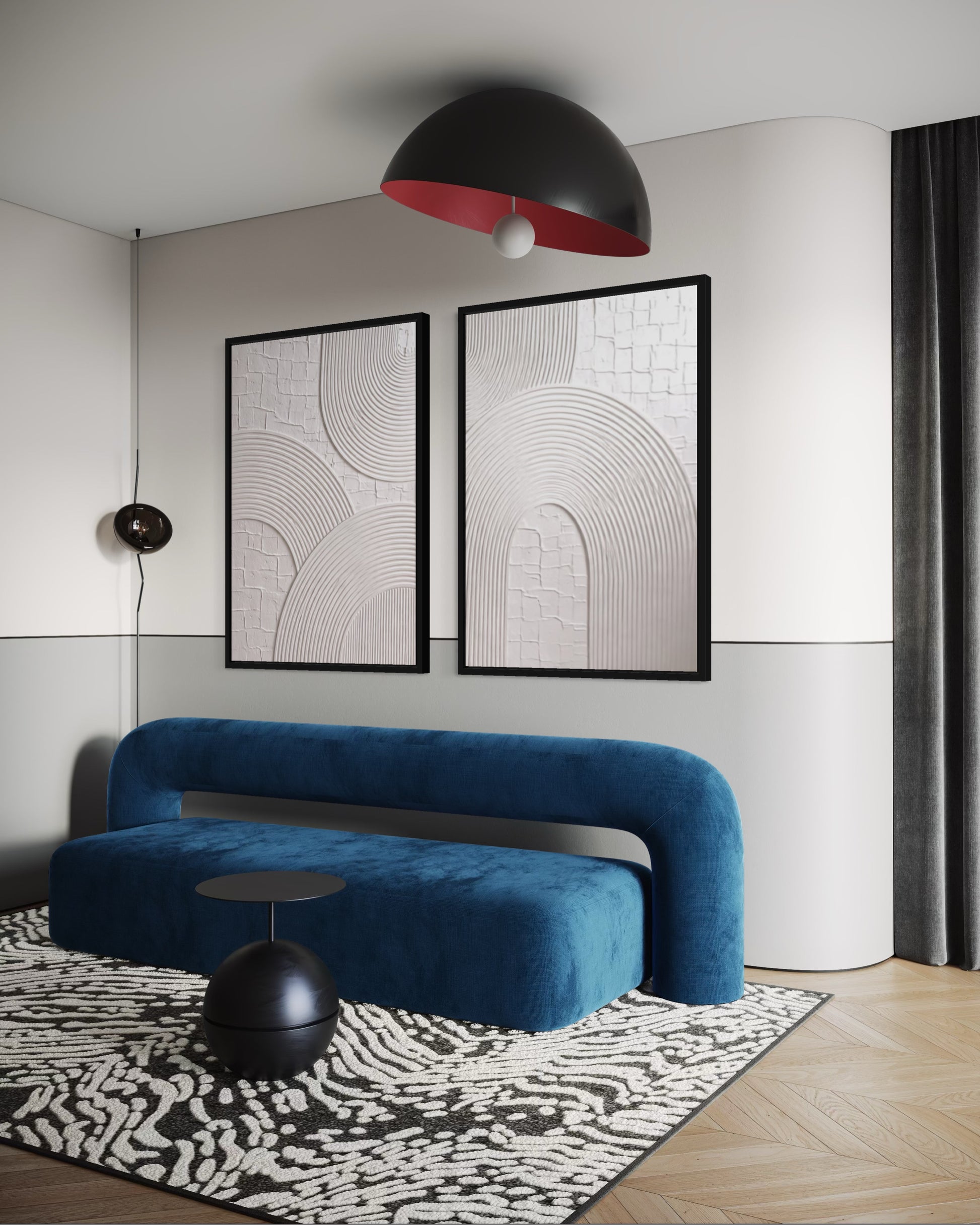 Modern living room with a blue sofa, black pendant light, and abstract wall art.