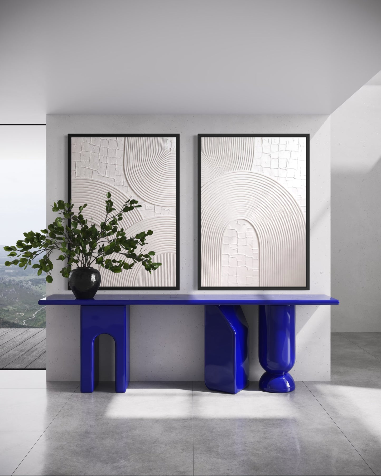 Modern interior with a blue console table, decorative plant, and abstract wall art.