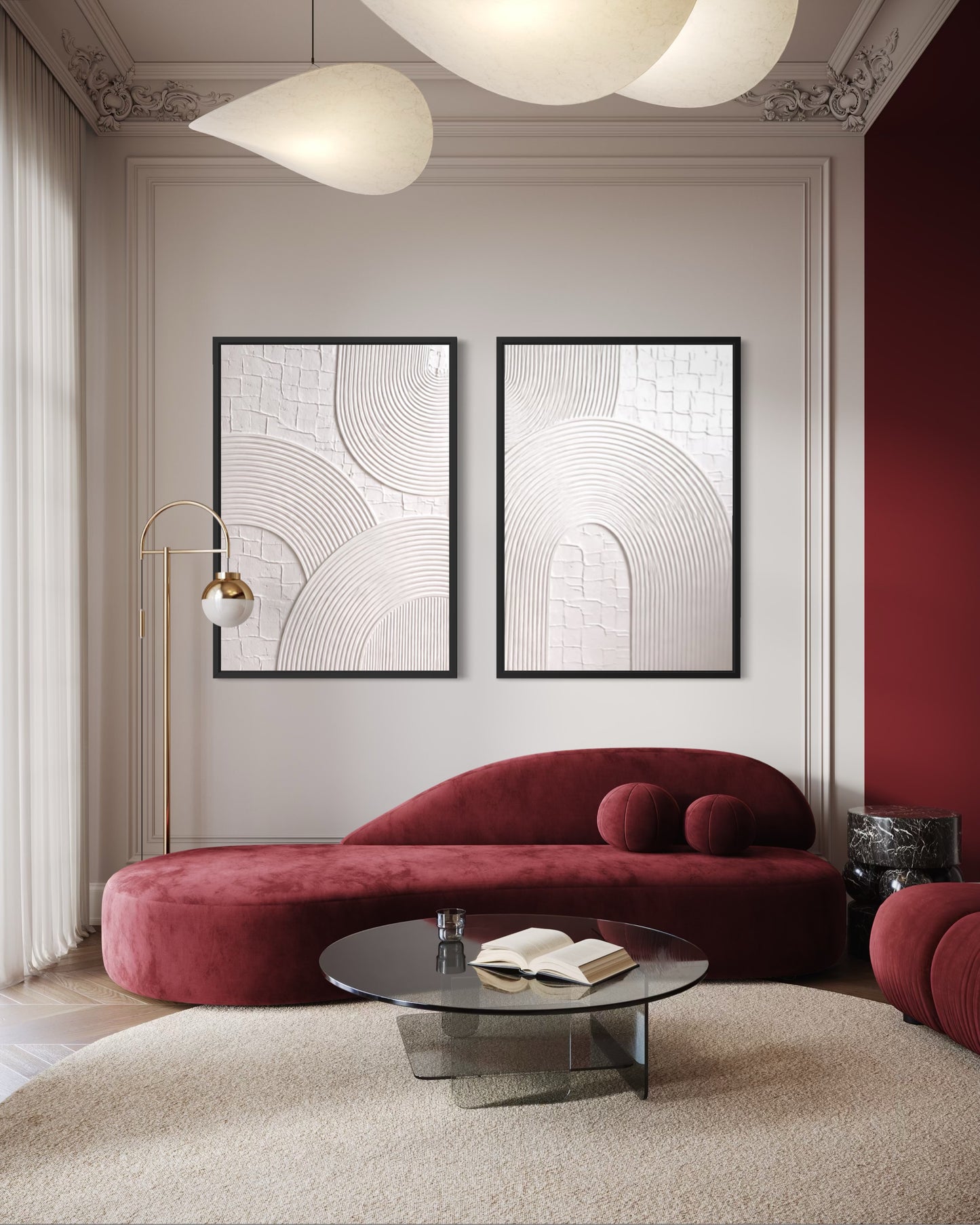Modern living room with a red sofa, round coffee table, and abstract wall art.