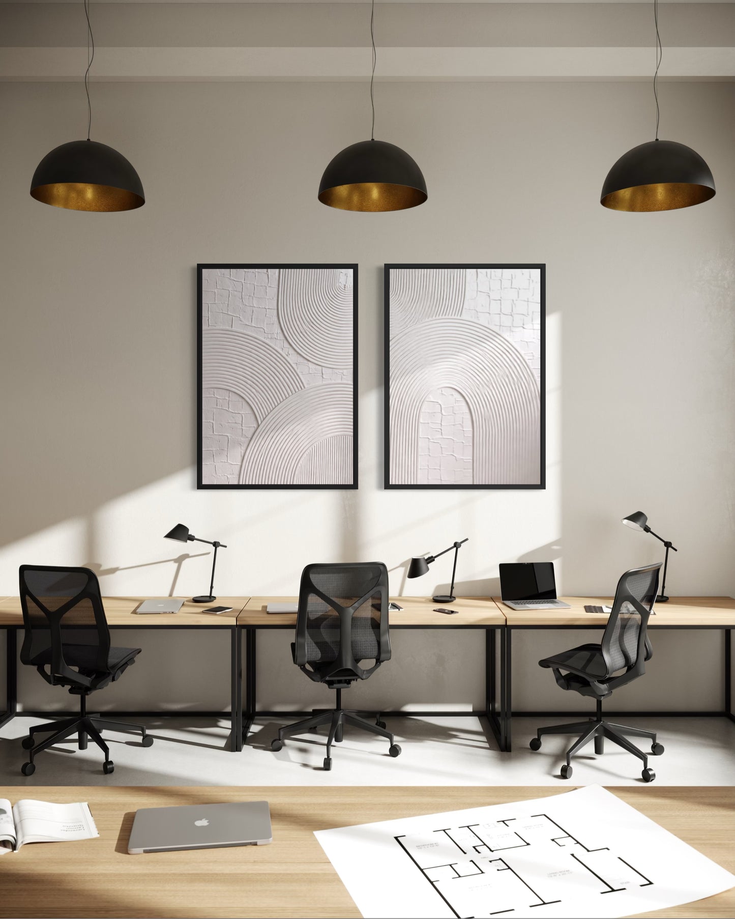 Modern office setup with desks, chairs, and wall art in a well-lit room.