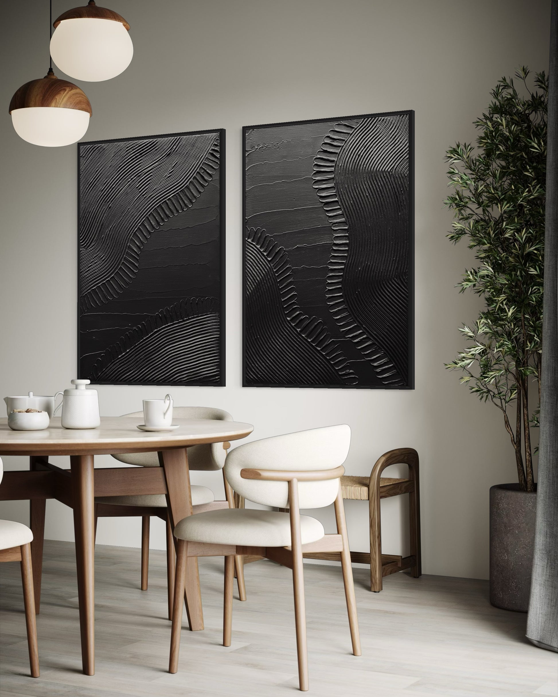 Dining room with wooden table and chairs, abstract black artwork on the wall, and a potted plant.