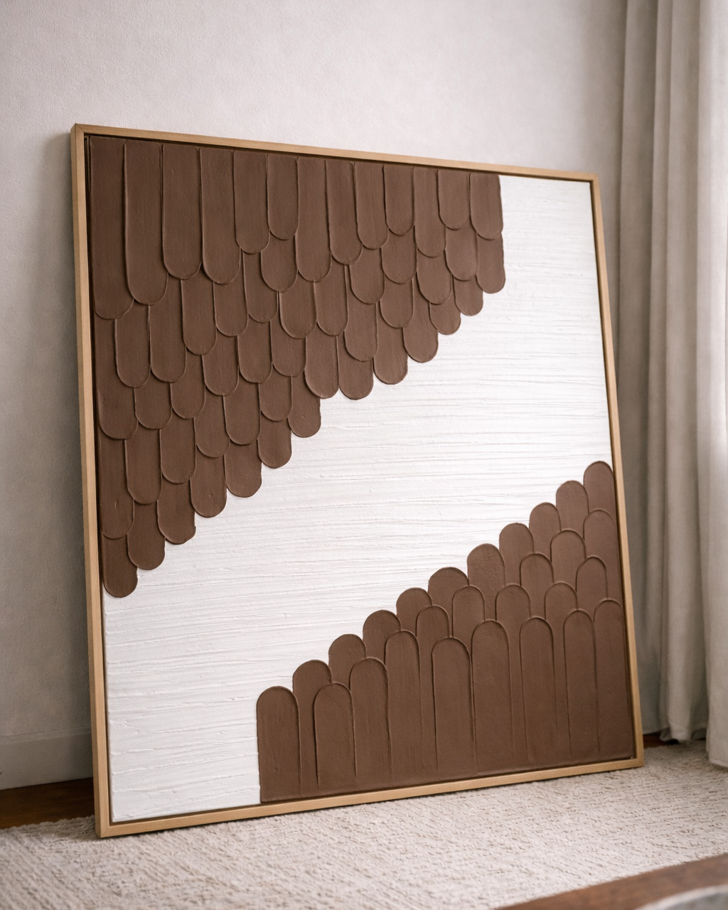 Decorative wall art with brown geometric pattern in a gold frame.