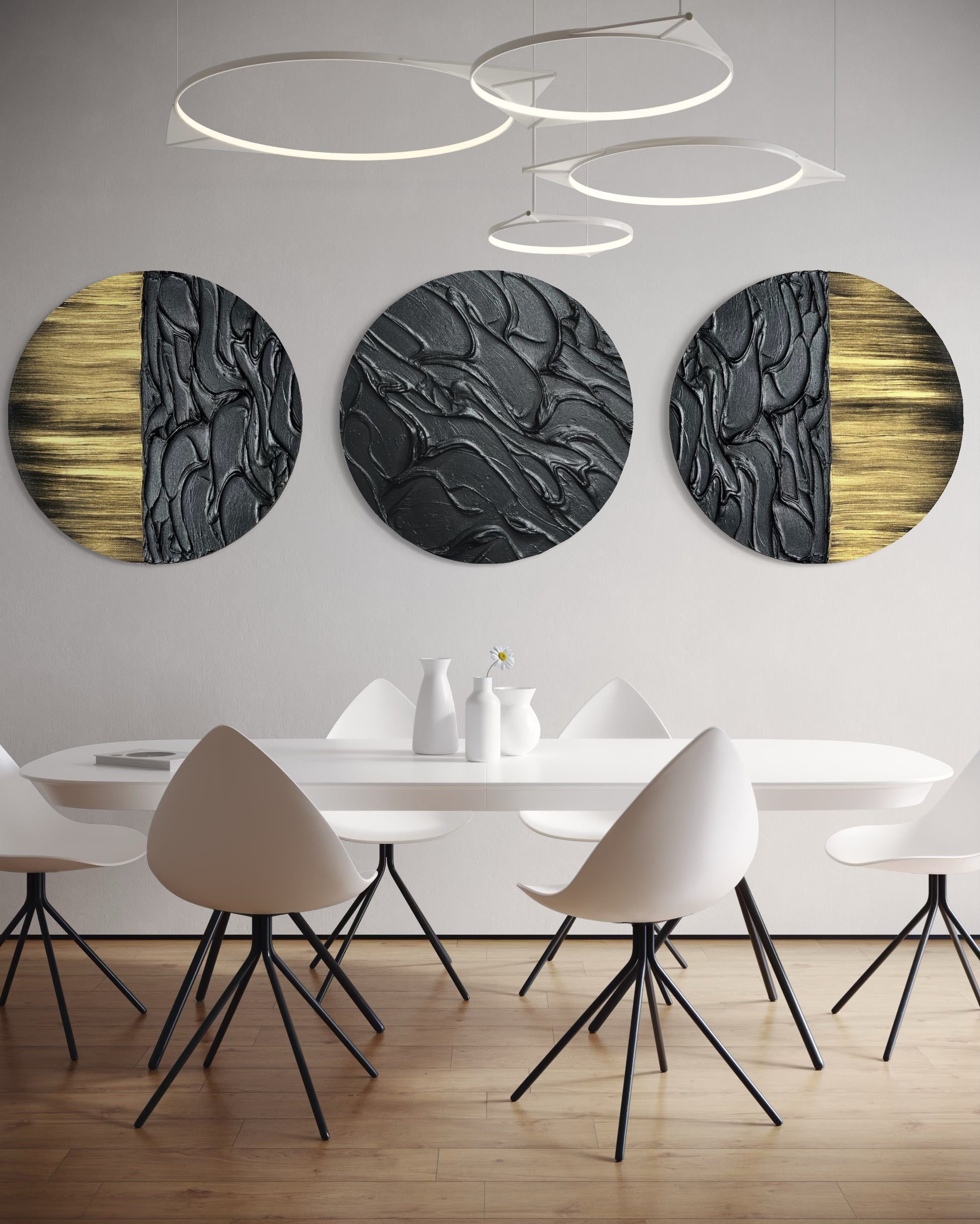 Sculptural black textured wall art with metallic gold accents in set of three