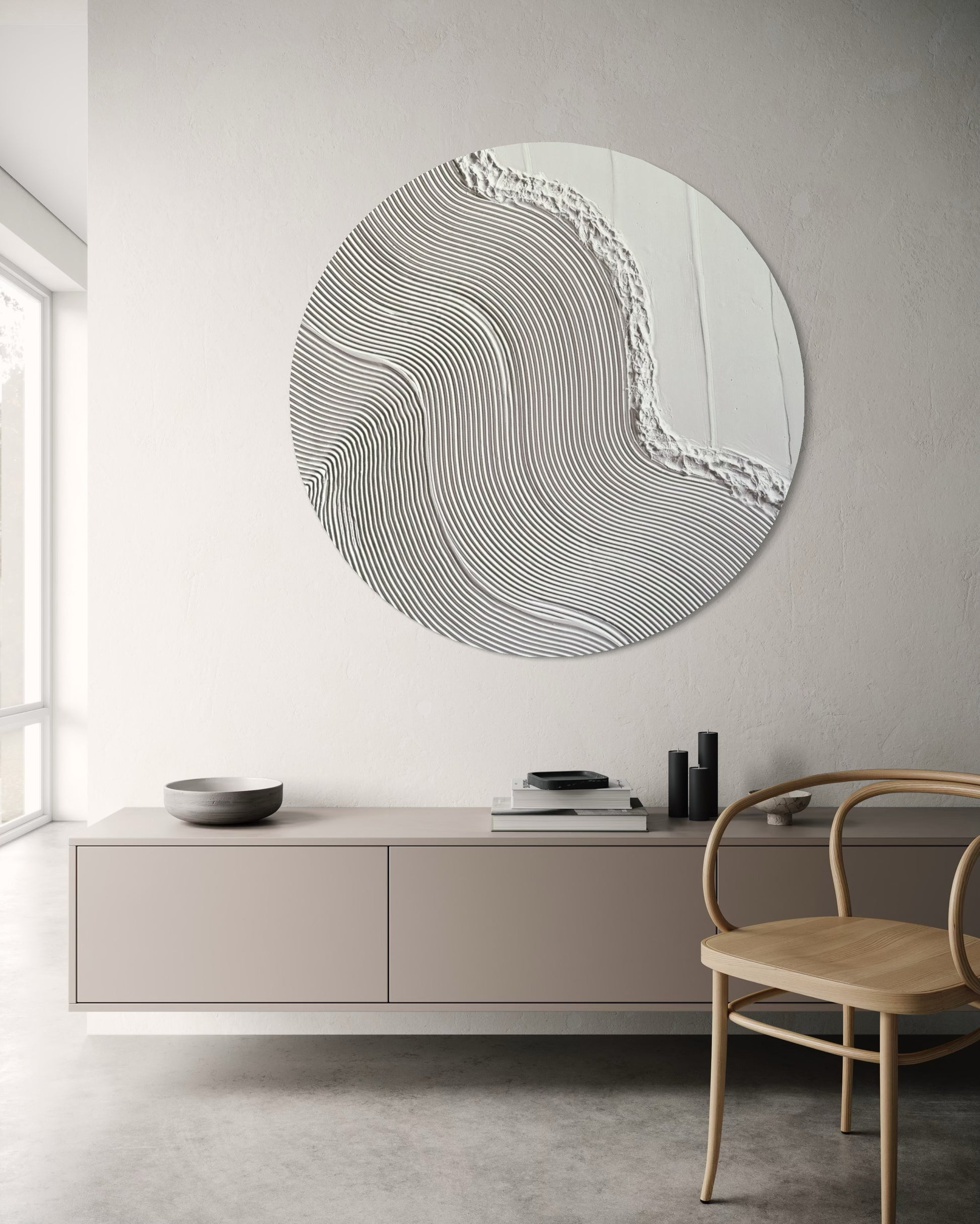 Minimalist circular canvas art in all-white with raised texture