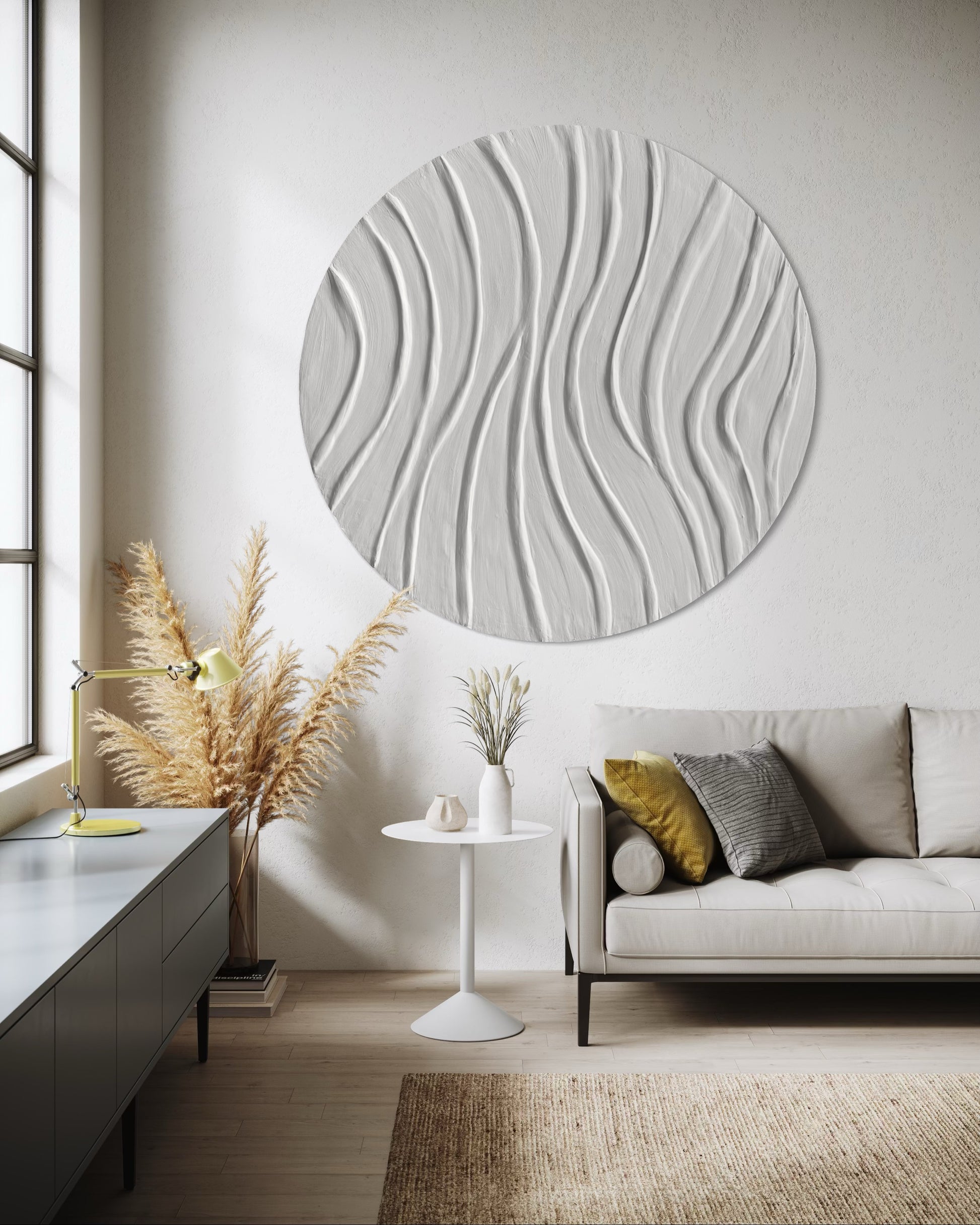 Modern living room with a round textured wall art piece, sofa, and decor elements.