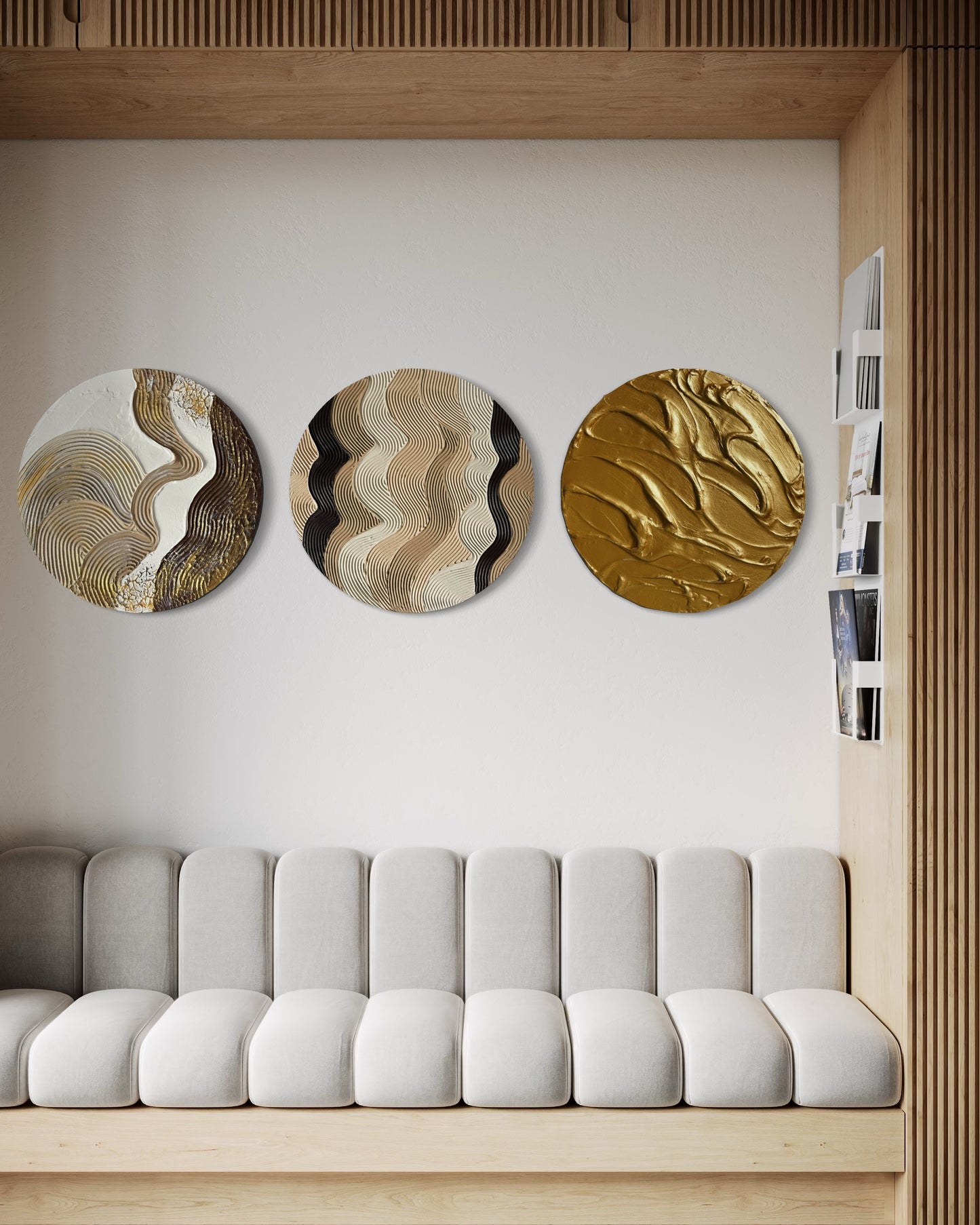 Three circular wall art pieces on a white wall above a gray sofa.