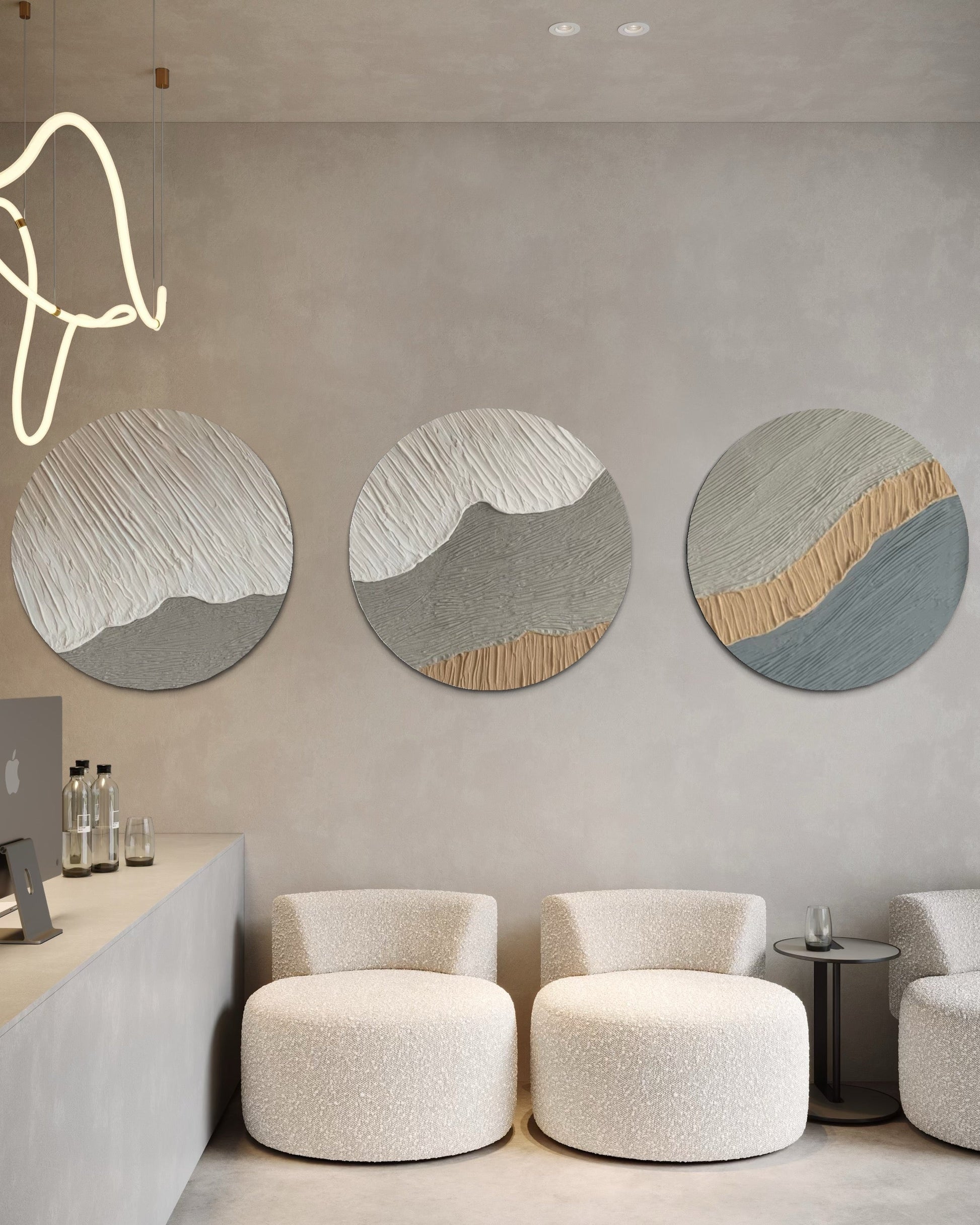 Modern interior with round abstract wall art set of 3  and white chairs.