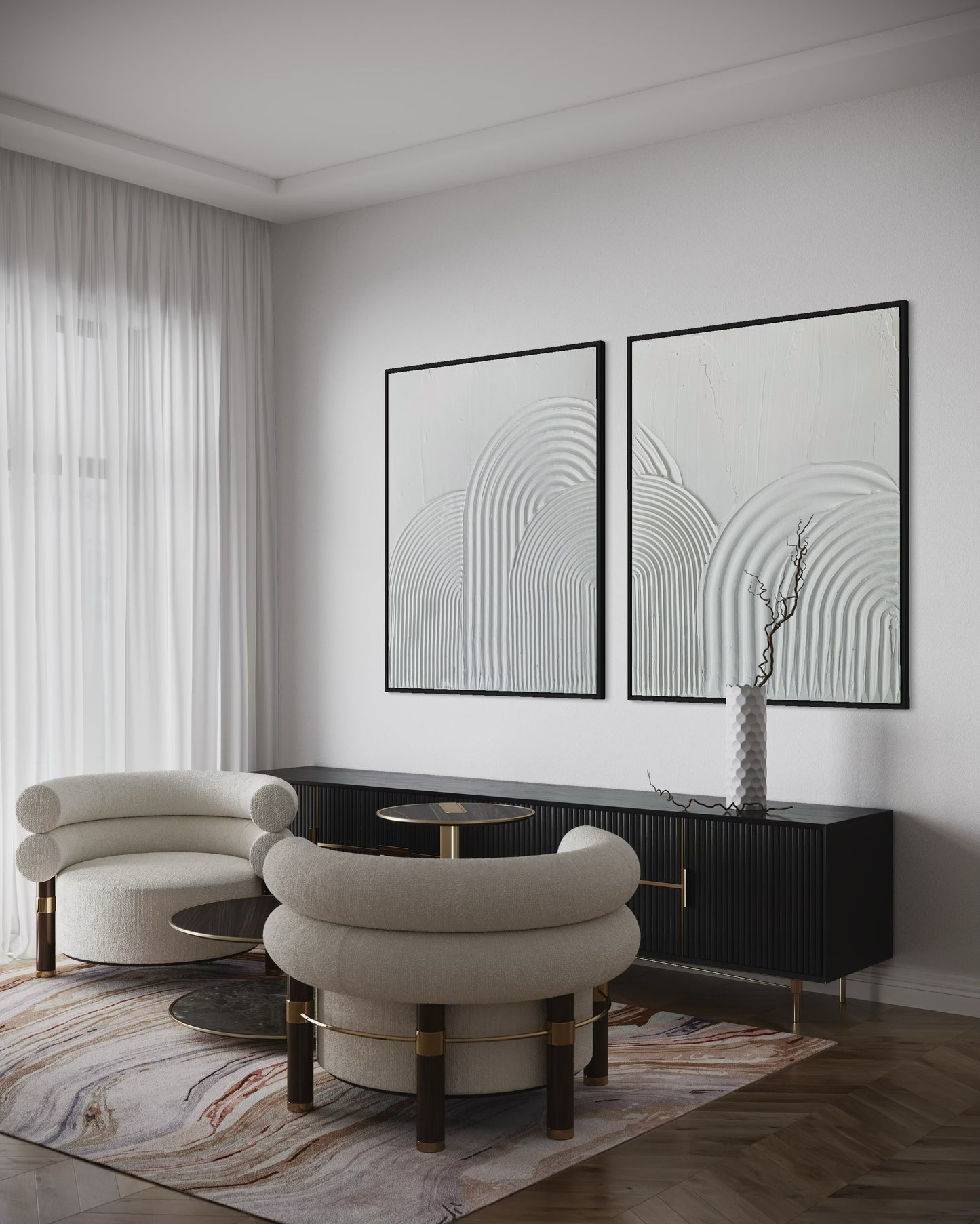 Modern living room with white chairs, a black console table, and abstract wall art.