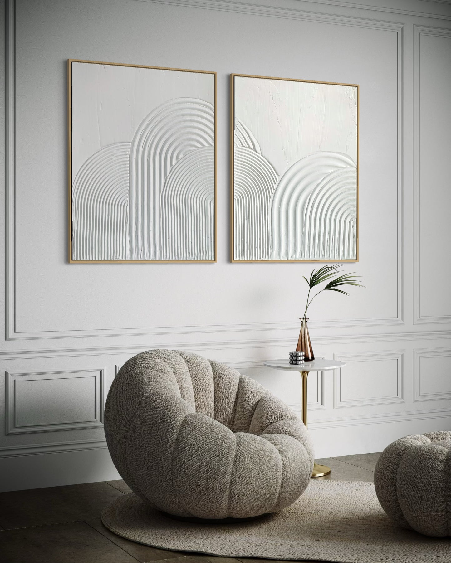 Modern interior with a round gray chair, small table, and abstract minimalist wall art set of 2 in white 